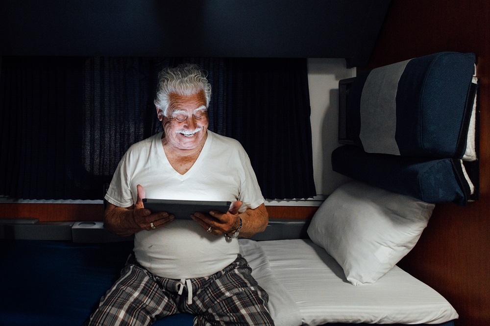 superliner-accessible-bedroom-tablet-at-night